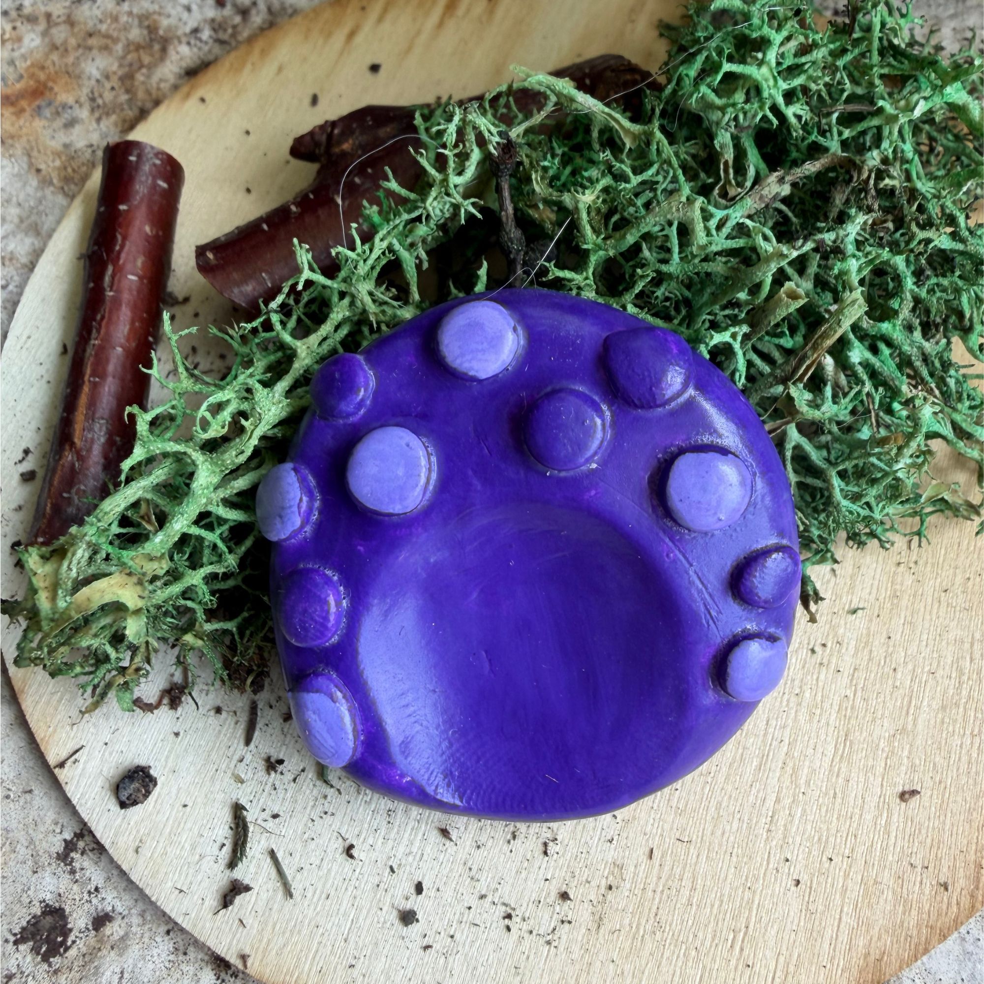 purpletexturesands purple polymer clay worry stone with raised bumps in various purple colors