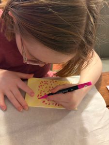 showing del at work with her markers
