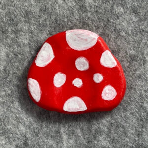 Handmade red mushroom polymer clay worry stone